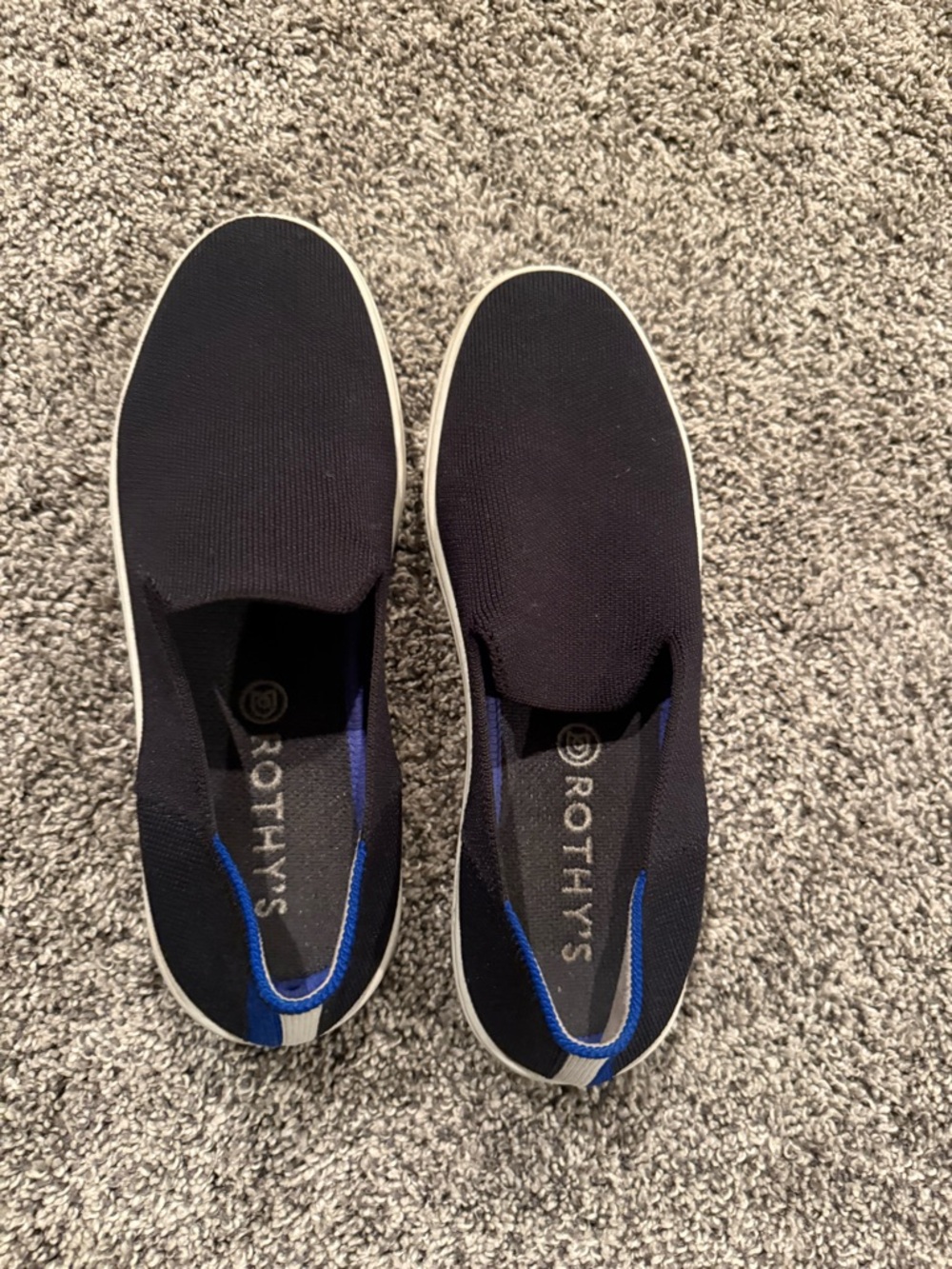 Rothy's Women’s The Original Slip-On Sneakers in Black with Blue Accent